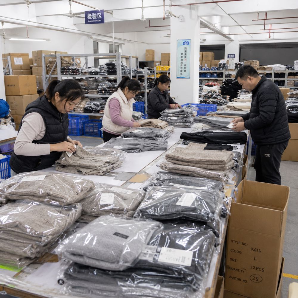 EverKnit packing area — sweaters bagged, labeled and boxed for shipment